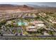 Overhead view of the community pool, clubhouse, parking and manicured landscaping at 283 Parisian Springs Ct, Las Vegas, NV 89148