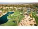 Aerial view of golf course with beautiful fairways and landscaping and a large lake at 283 Parisian Springs Ct, Las Vegas, NV 89148