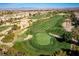 Lush golf course featuring manicured greens, sand traps and tall palms at 283 Parisian Springs Ct, Las Vegas, NV 89148