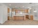 Well-lit kitchen with a center island, modern appliances, and plenty of cabinet space at 283 Parisian Springs Ct, Las Vegas, NV 89148