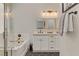 Elegant bathroom featuring a soaking tub, a separate shower, and a double vanity with modern fixtures at 3021 Scenic Valley Way, Henderson, NV 89052