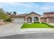 Charming single-story home with a well-manicured lawn, a two-car garage, and a welcoming entrance at 3021 Scenic Valley Way, Henderson, NV 89052