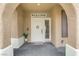 Inviting front porch with decorative accents, including a Welcome sign and a potted plant at 3021 Scenic Valley Way, Henderson, NV 89052