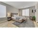 Serene main bedroom with large windows, a king-size bed, and stylish decor at 3021 Scenic Valley Way, Henderson, NV 89052