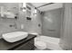 Modern bathroom with tile walls, a tub, and a sleek vanity at 3157 Pinehurst Dr # B, Las Vegas, NV 89109