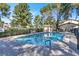 Inviting community pool area surrounded by lush landscaping at 3157 Pinehurst Dr # B, Las Vegas, NV 89109