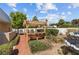 Backyard pergola surrounded by lush landscaping and greenery, perfect for outdoor relaxation at 3585 Tobias Ln, Las Vegas, NV 89120