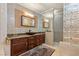 Modern bathroom with a granite countertop vanity, mosaic tiled walls, and glass block features at 3585 Tobias Ln, Las Vegas, NV 89120