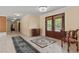 Spacious foyer with marble floors, decorative rug, elegant lighting, and carved wood front doors at 3585 Tobias Ln, Las Vegas, NV 89120