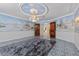 Grand living room with mural walls, ornate ceiling, and ornate wood doors at 3585 Tobias Ln, Las Vegas, NV 89120