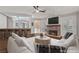 Living room with exposed brick fireplace and wet bar at 3585 Tobias Ln, Las Vegas, NV 89120