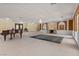 Spacious living room featuring decorative fireplace, chandelier, and piano at 3585 Tobias Ln, Las Vegas, NV 89120