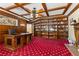 Spacious home office with coffered ceiling, custom built-in bookshelves, fireplace, and large executive desk at 3585 Tobias Ln, Las Vegas, NV 89120