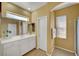 Bathroom featuring a double vanity with white cabinets and tile floors at 3741 Lily Haven Ave, Las Vegas, NV 89120