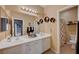 Bathroom with double vanity, large mirror, and a shower/tub combination at 3741 Lily Haven Ave, Las Vegas, NV 89120