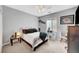 Cozy bedroom with neutral carpet, a ceiling fan, and a window at 3741 Lily Haven Ave, Las Vegas, NV 89120