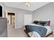 Bedroom with neutral carpet, ceiling fan, and view to ensuite bathroom at 3741 Lily Haven Ave, Las Vegas, NV 89120