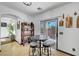 Breakfast nook with bar table and sliding glass door leading to the backyard at 3741 Lily Haven Ave, Las Vegas, NV 89120