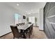 Elegant dining room with stylish table, modern decor, and natural lighting at 3741 Lily Haven Ave, Las Vegas, NV 89120