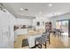 Spacious kitchen features a breakfast bar with seating, white cabinetry, and modern appliances at 3741 Lily Haven Ave, Las Vegas, NV 89120