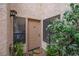 Condo entrance with potted plants, large windows and a colorful welcome mat at 3883 Desert Marina Dr # 245, Laughlin, NV 89029