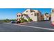 Condominium complex with a parking area, mature landscaping and multiple units at 3883 Desert Marina Dr # 245, Laughlin, NV 89029