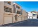 Condominium exterior featuring multiple garages, stairwell and balcony at 3883 Desert Marina Dr # 245, Laughlin, NV 89029