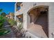 Exterior staircase of condominium unit 24 with natural light, manicured shrubs and plants at 3883 Desert Marina Dr # 245, Laughlin, NV 89029