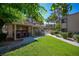 Poolside community BBQ area with covered grills and lush landscaping at 3883 Desert Marina Dr # 245, Laughlin, NV 89029