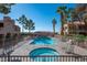 Inviting pool area with a hot tub and deck chairs, surrounded by mature trees at 3883 Desert Marina Dr # 245, Laughlin, NV 89029