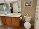 Half bathroom featuring a single sink vanity, toilet, and coordinated accessories at 4058 Helens Pouroff Ave, North Las Vegas, NV 89085