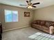 Comfortable bedroom featuring neutral walls, ceiling fan, and plush carpeting at 4058 Helens Pouroff Ave, North Las Vegas, NV 89085