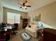 Bedroom featuring a large window with a loveseat and desk at 4058 Helens Pouroff Ave, North Las Vegas, NV 89085