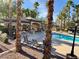 Relaxing community pool area with shaded seating, perfect for enjoying sunny days and outdoor leisure at 4058 Helens Pouroff Ave, North Las Vegas, NV 89085