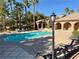 Beautiful community pool with ample lounge seating and a well-maintained deck, ideal for relaxation and socializing at 4058 Helens Pouroff Ave, North Las Vegas, NV 89085