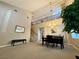 Open dining room featuring soaring ceilings, a decorative chandelier, and staircase to the upper level at 4058 Helens Pouroff Ave, North Las Vegas, NV 89085