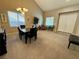 Bright dining room boasts high ceilings and an ornate chandelier, perfect for formal dinners at 4058 Helens Pouroff Ave, North Las Vegas, NV 89085