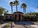 Community building featuring lush landscaping and mature palm trees at 4058 Helens Pouroff Ave, North Las Vegas, NV 89085