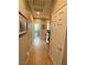 Hallway featuring tile flooring and connecting doors at 4058 Helens Pouroff Ave, North Las Vegas, NV 89085