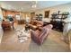 Open floor plan living room and kitchen featuring tile flooring and neutral decor at 4058 Helens Pouroff Ave, North Las Vegas, NV 89085