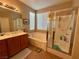 Main bath featuring tub and separate glass enclosed shower at 4058 Helens Pouroff Ave, North Las Vegas, NV 89085