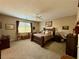 Comfortable main bedroom featuring a king bed, neutral walls and a ceiling fan at 4058 Helens Pouroff Ave, North Las Vegas, NV 89085