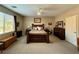 Spacious main bedroom with a ceiling fan, neutral walls, and a large window for natural light at 4058 Helens Pouroff Ave, North Las Vegas, NV 89085