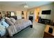 Spacious main bedroom featuring neutral walls, a ceiling fan and access to the main bath at 4058 Helens Pouroff Ave, North Las Vegas, NV 89085