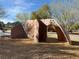 Climbing structure with an arched design provides outdoor activity at the community playground at 4058 Helens Pouroff Ave, North Las Vegas, NV 89085