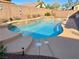 Inviting backyard pool, features decorative stone accents and is perfect for relaxation and outdoor entertaining at 4058 Helens Pouroff Ave, North Las Vegas, NV 89085