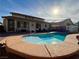 Inviting backyard pool with sunny patio and lounge chairs, perfect for relaxation and outdoor entertaining at 4058 Helens Pouroff Ave, North Las Vegas, NV 89085