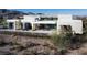 Contemporary home showcasing a sleek design with a well-maintained landscape and mountain backdrop at 41 Crested Cloud Way, Las Vegas, NV 89135