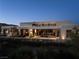 Night view of modern home boasting an open design, desert landscaping and inviting pool area at 41 Crested Cloud Way, Las Vegas, NV 89135