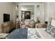 View of the main bedroom with high-end finishes, neutral tones, and a sitting area at 41 Crested Cloud Way, Las Vegas, NV 89135